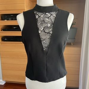 Beautiful top from Anthropologie… size Medium. Black with lace inset. Very sexy!